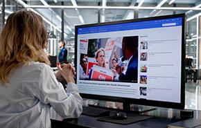 Journalist Reading Online News Articles 