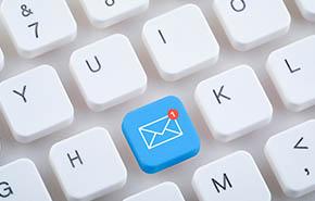 Computer keyboard with new email button. 